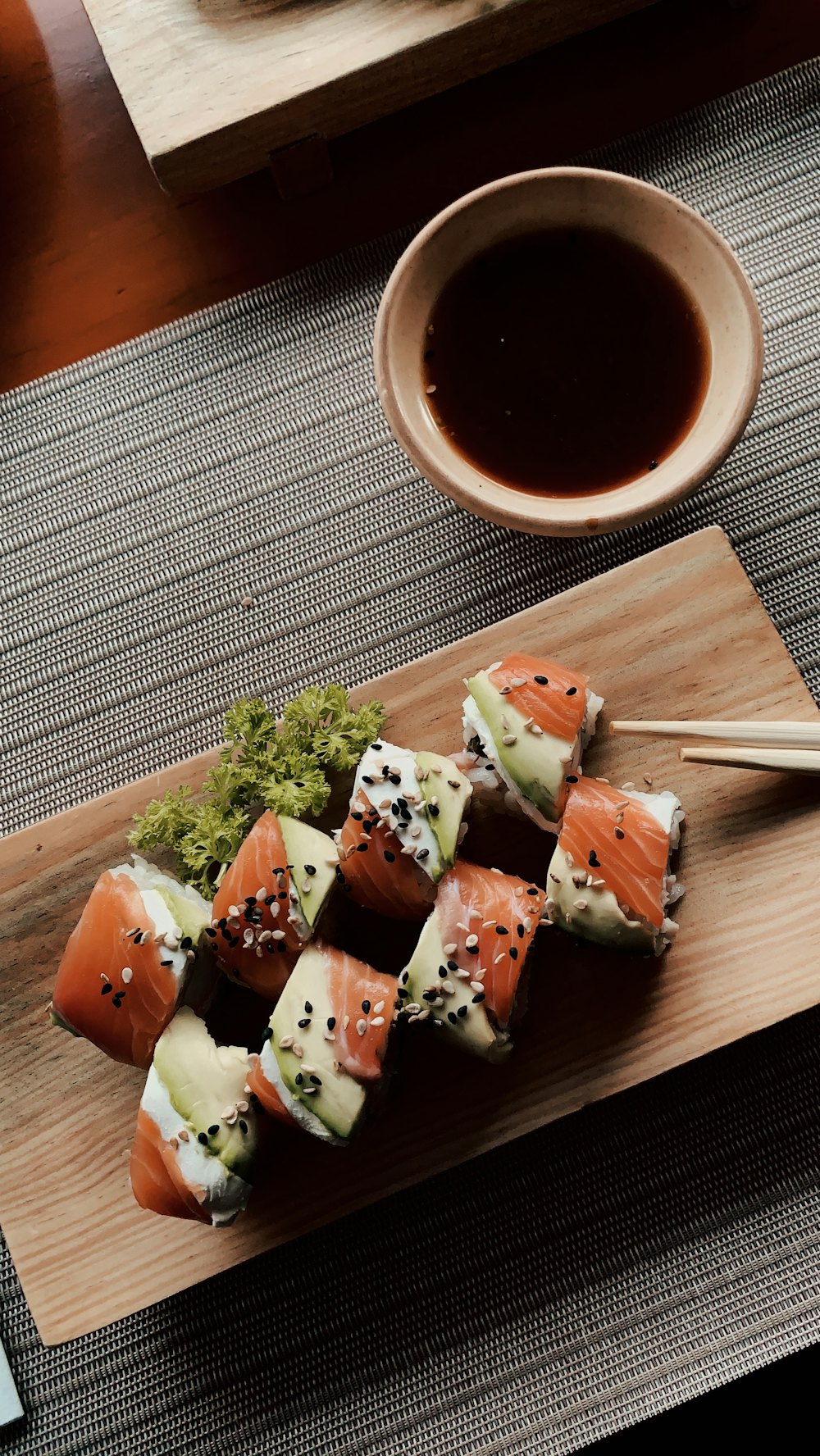 Sushi rolls on a wooden board